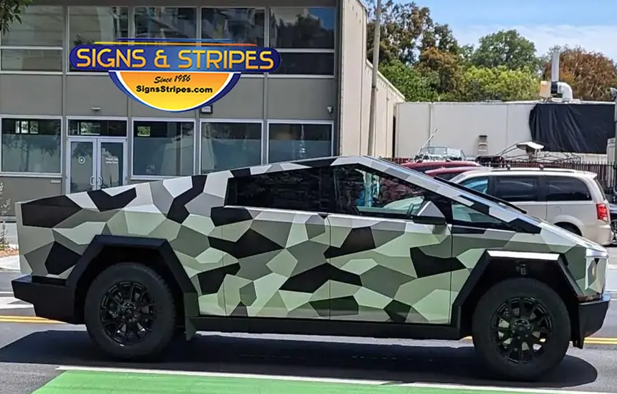 Cybertruck custom wrap with geometric green and black camo