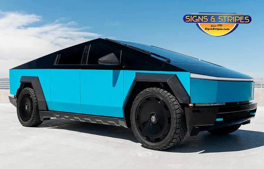 Tesla Cybertruck custom wrap in gloss teal blue with black accents